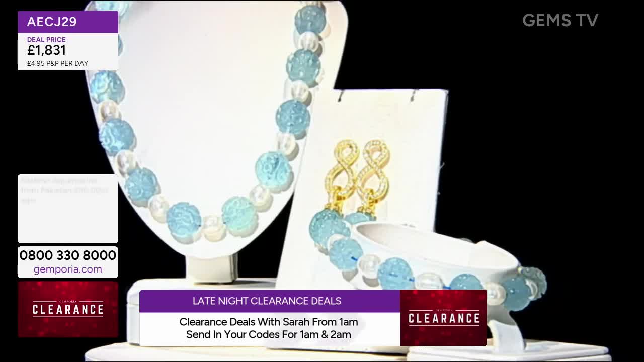 A necklace and bracelet of pale blue beads and white pearls are displayed, along with a pair of gold earrings. The screen promotes "Late Night Clearance Deals" on Gems TV.
