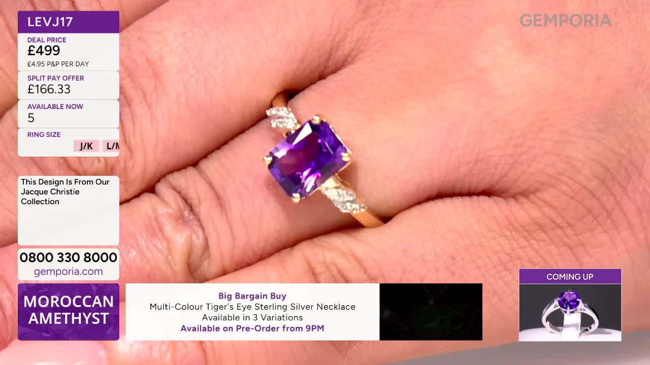 A hand turns, showcasing a striking amethyst ring with diamond accents. The Gems TV screen displays pricing and details for this Jacque Christie design.