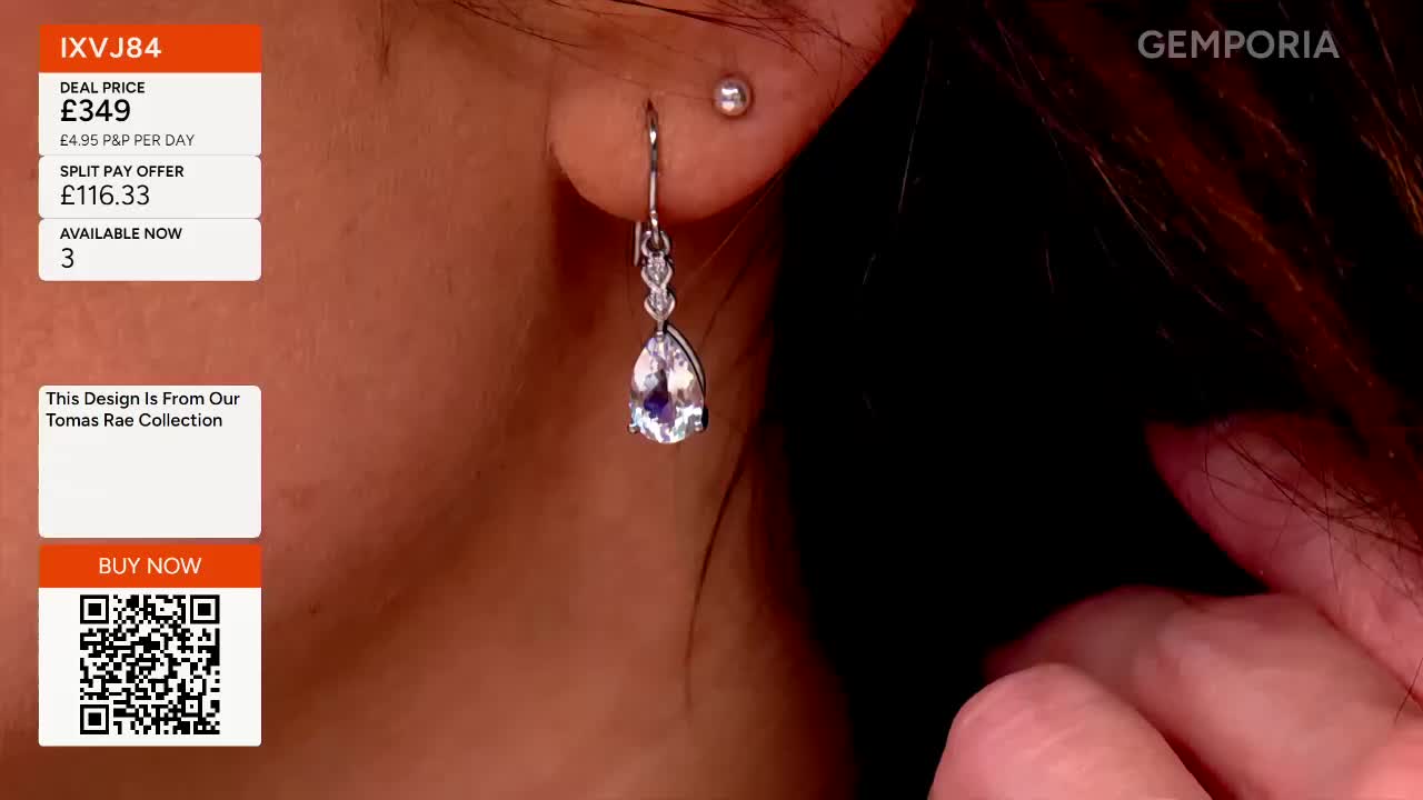 A silver earring with a pear-shaped stone dangles from a woman's ear. The Gems TV logo is visible in the top right corner.