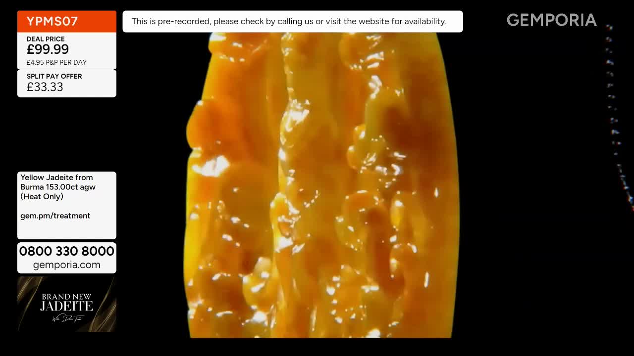 A large, textured yellow jadeite stone, likely from Burma, is rotating slowly on a black background. The Gems TV logo, Gemporia, appears in the upper right corner.