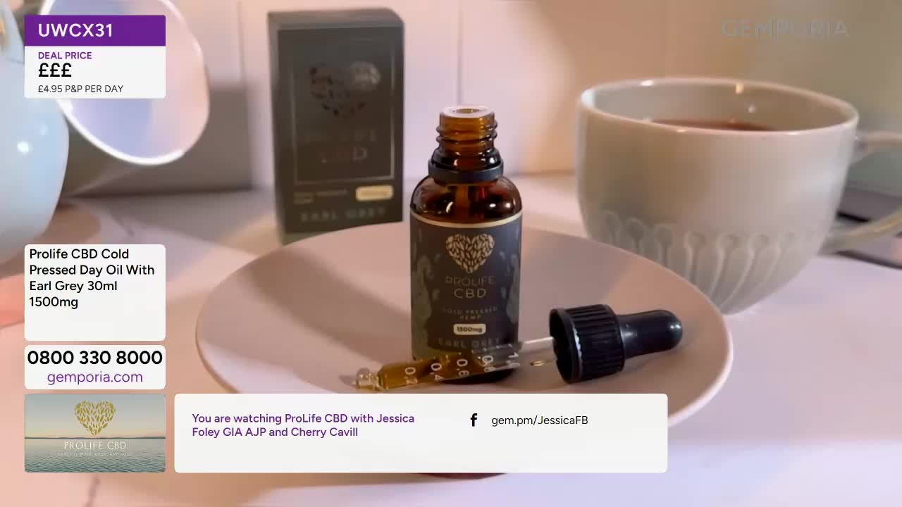 A bottle of Prolife CBD oil sits on a small plate, a dropper resting beside it. A mug of tea steams gently in the background, completing the cosy scene.