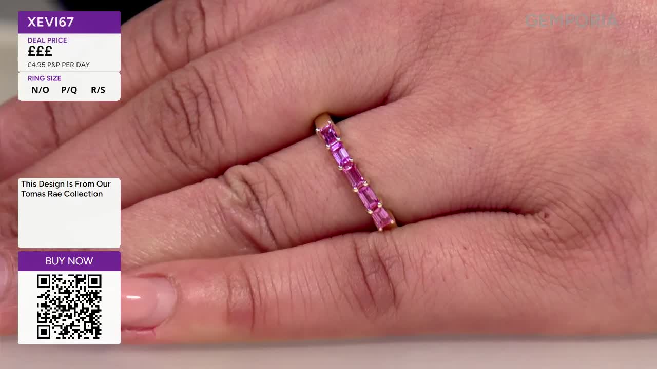 A hand displays a delicate ring set with alternating pink and purple baguette-cut stones. The ring, part of the Tomas Rae Collection, sits on a finger, catching the light as the hand moves.