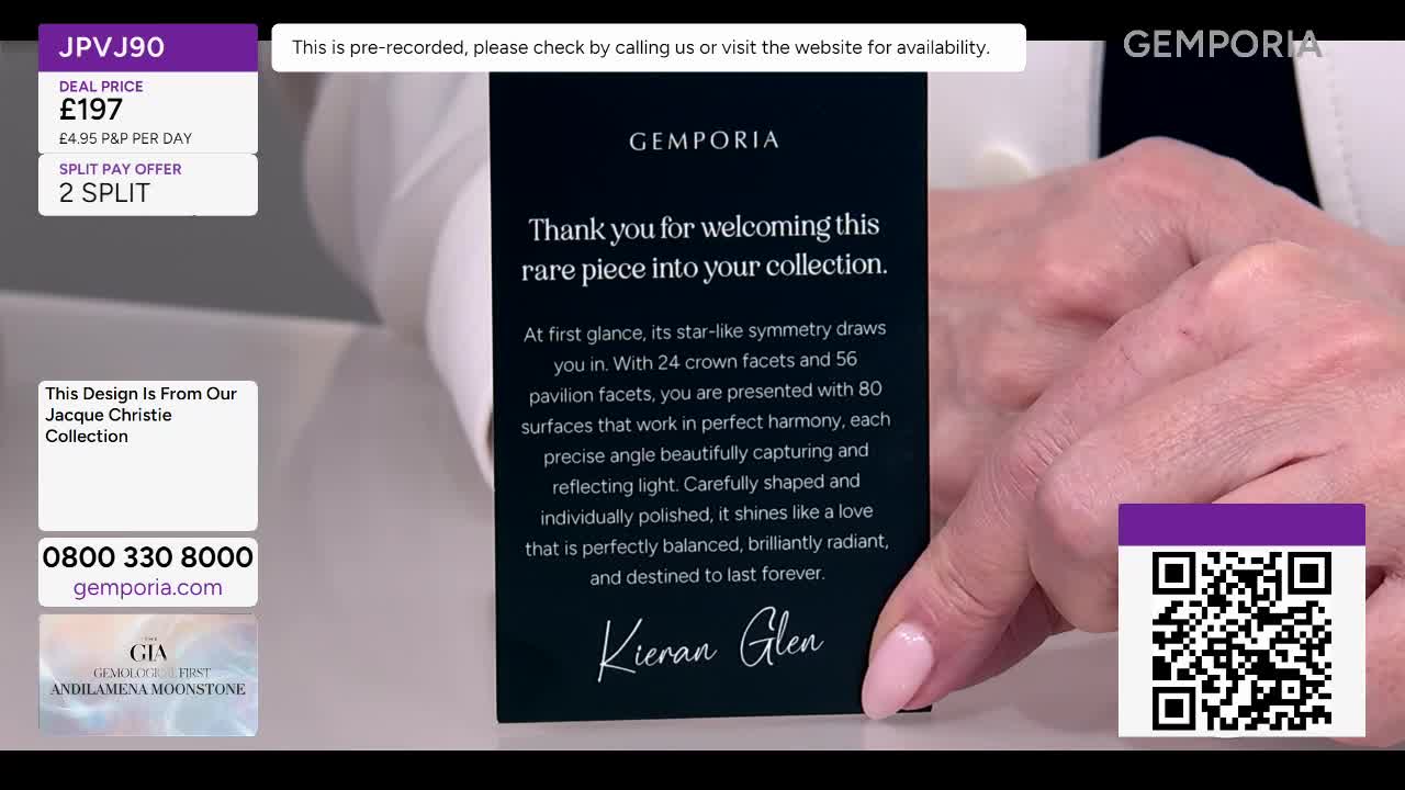 A hand holding a dark card with text about a rare piece from the Jacque Christie Collection. The card is angled, revealing a glimpse of a person's arm and shoulder.