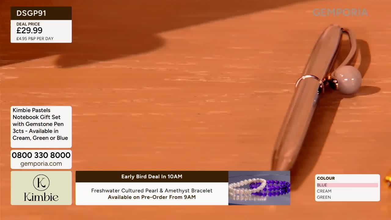 A silver pen with a pearl-like bead rests on a warm-toned surface. A graphic displays details for a Kimbie notebook gift set and a freshwater pearl and amethyst bracelet.