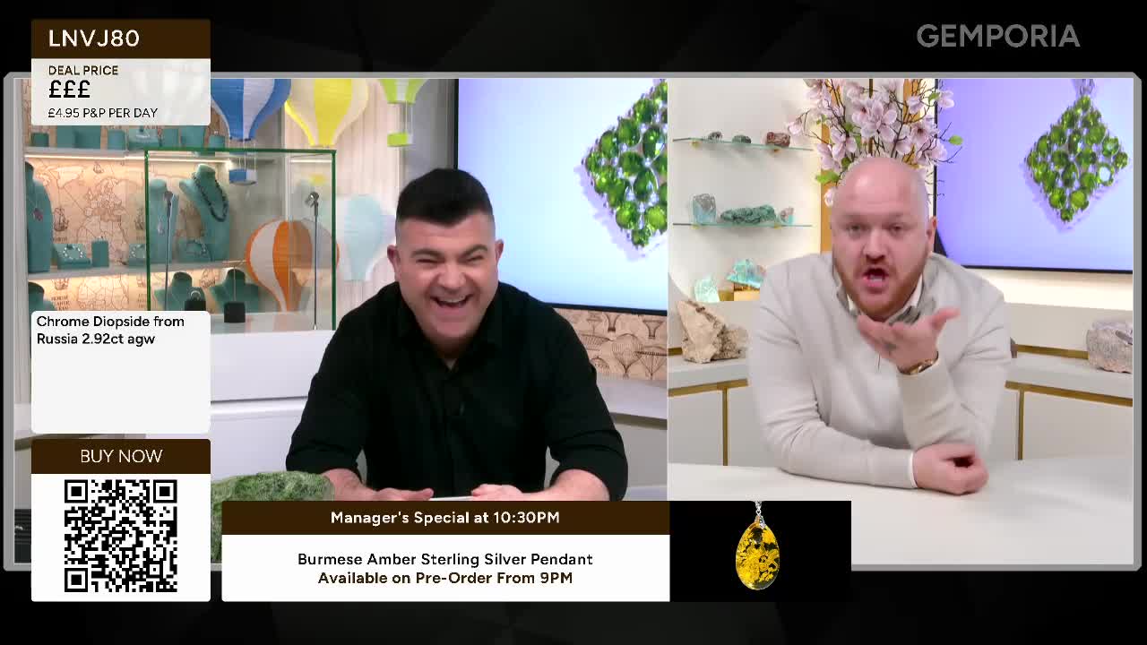 A man in a black shirt laughs heartily, his face crinkled with amusement. Beside him, another man in a light grey sweater gestures with his hand, speaking animatedly. A man in a black shirt laughs heartily, his face crinkled with amusement. Beside him, another man in a light grey sweater gestures with his hand, speaking animatedly.