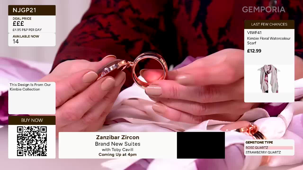 Hands are opening a rose gold locket, revealing a dark stone inside. A light pink scarf with a floral pattern is displayed on screen, priced at £12.99.