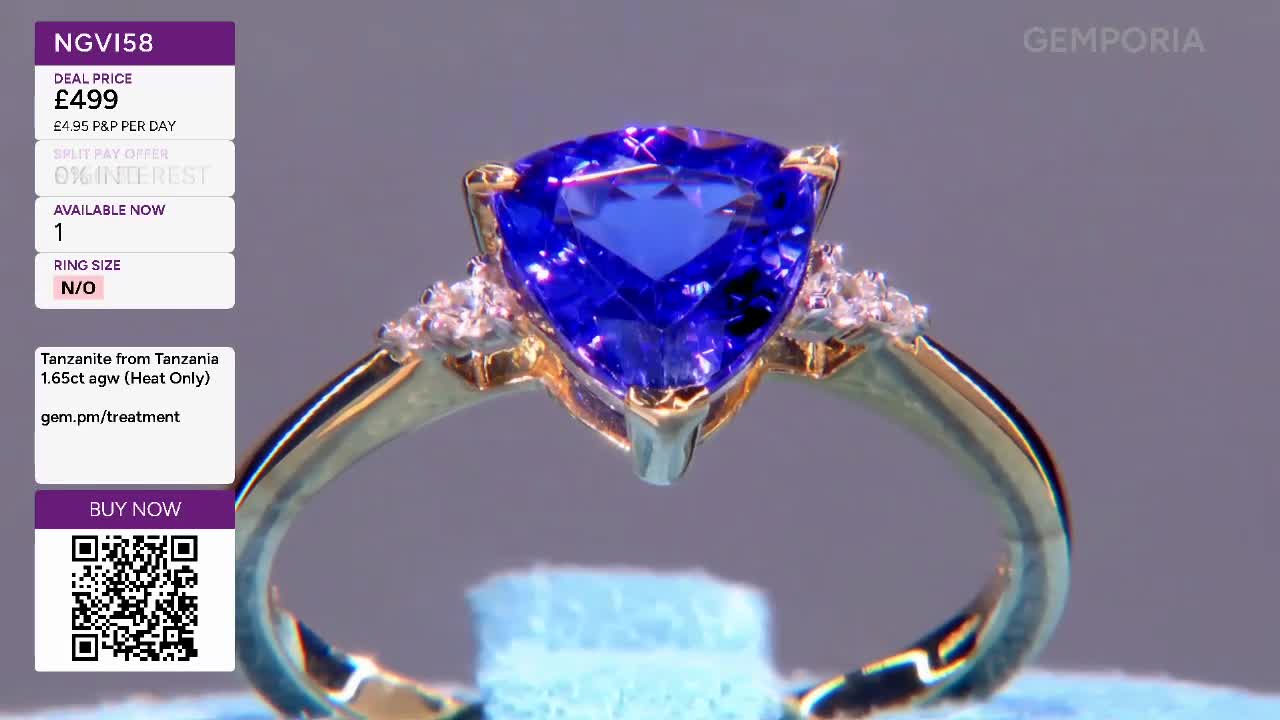 A triangular tanzanite, the colour of a deep twilight sky, sits atop a gold ring. Tiny diamonds sparkle on either side of the main stone, catching the light.