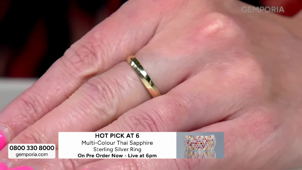 A hand displays a plain gold band on one finger, while another hand, adorned with a colourful ring, is held nearby. The Gems TV logo is visible in the corner. A hand displays a plain gold band on one finger, while another hand, adorned with a colourful ring, is held nearby. The Gems TV logo is visible in the corner.