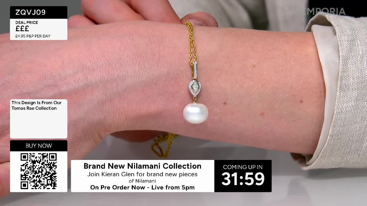 A delicate gold chain with a pearl pendant is displayed on an arm. The pendant features a teardrop shape encrusted with small, sparkling stones. A delicate gold chain with a pearl pendant is displayed on an arm. The pendant features a teardrop shape encrusted with small, sparkling stones.