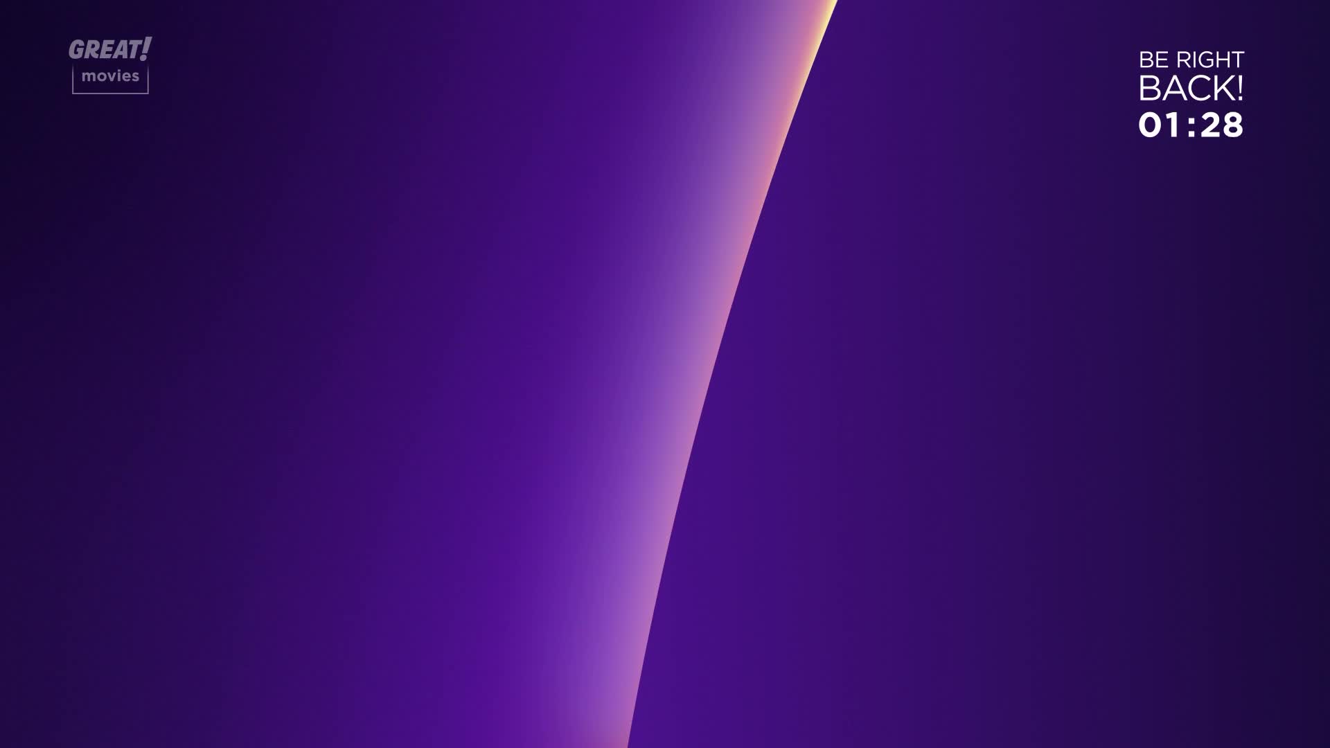 The screen is a deep purple, with a curved, glowing light cutting across it.  The GREAT! movies logo sits in the corner, and a timer counts down until the film returns.
