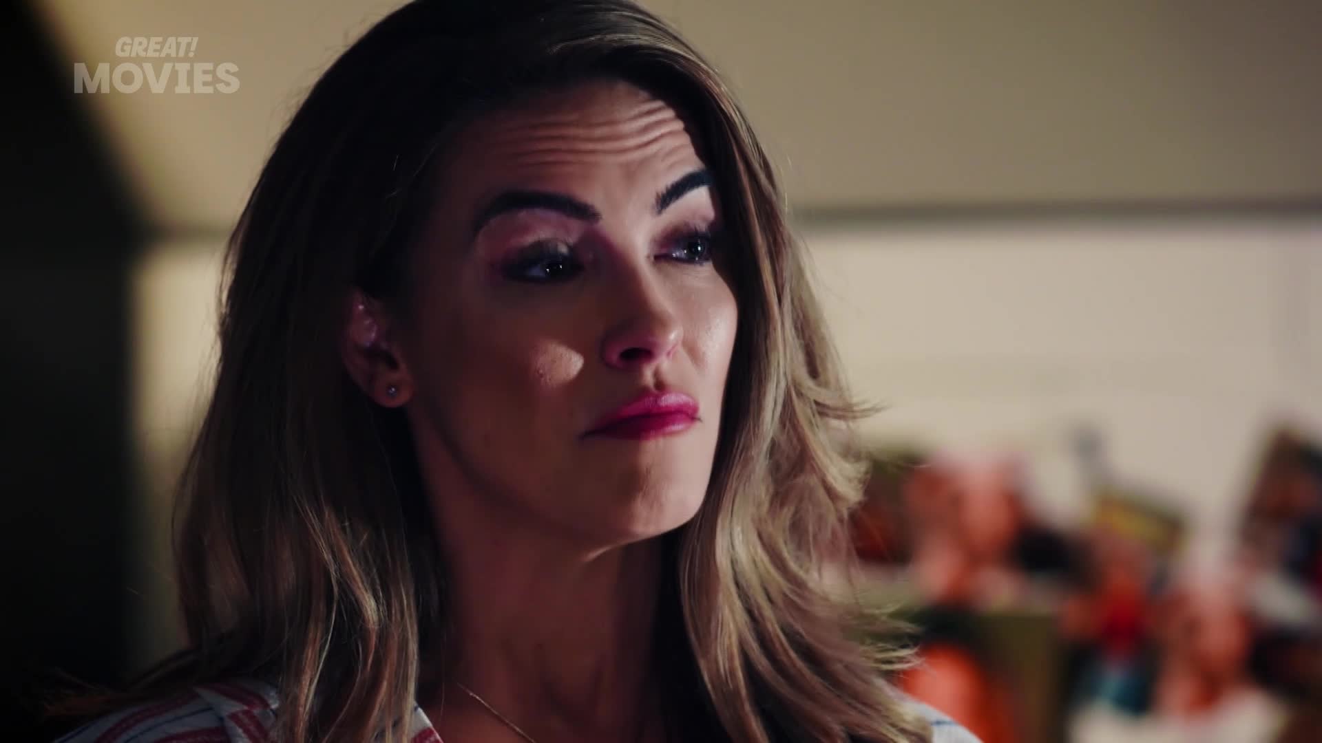 A woman with bright pink lipstick and eye shadow looks off to the side, her brow furrowed. The GREAT! MOVIES logo is visible in the upper left corner.