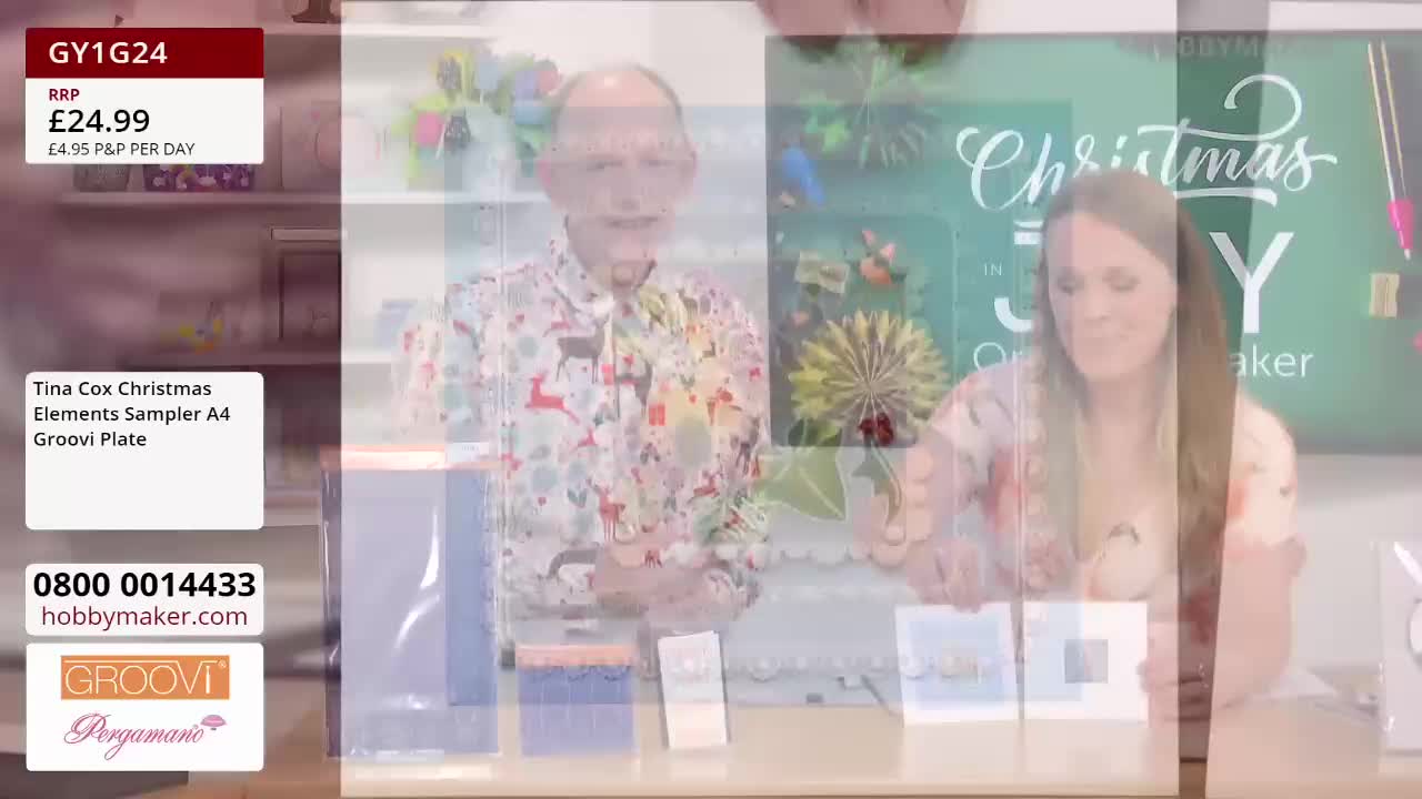 The two presenters, a man in a patterned shirt and a woman, are demonstrating craft projects on a Hobby Maker show. They're holding up finished cards and showing off the materials, including a Groovi Plate from the United Kingdom.
