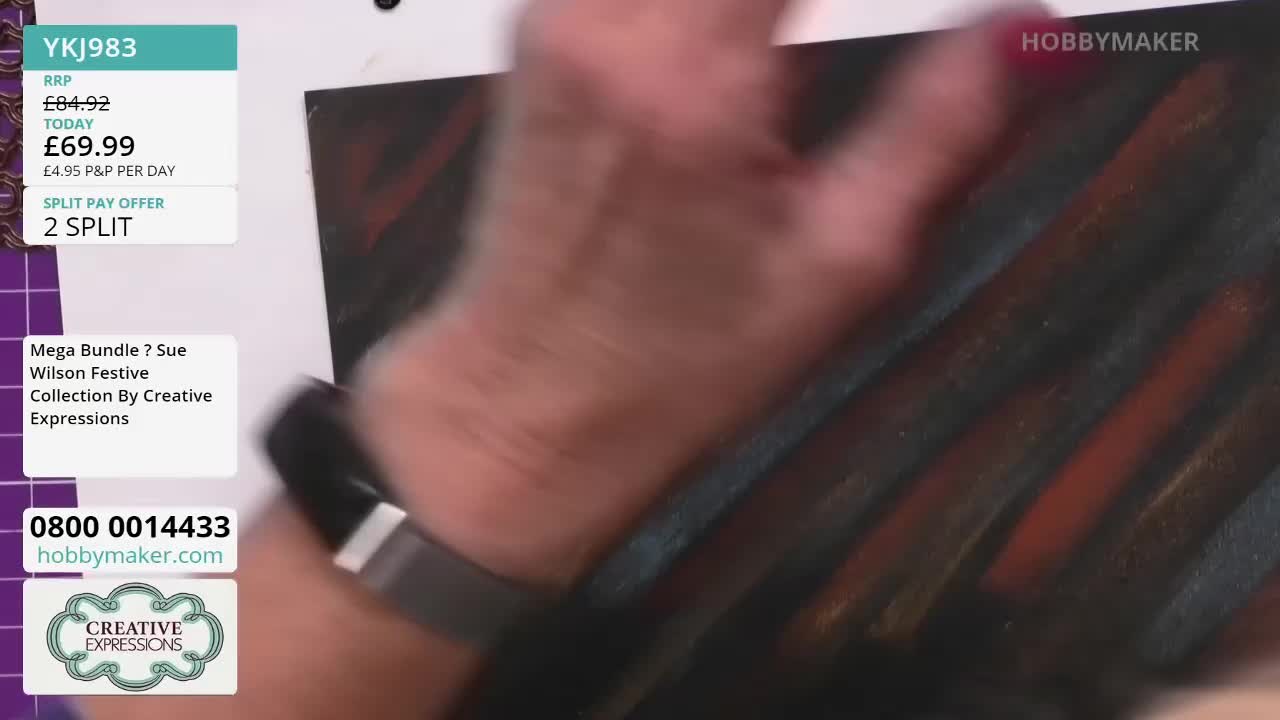 A hand, with a dark watch, is moving across the surface of a painting, smearing the diagonal streaks of color. The Hobby Maker logo is visible in the corner.
