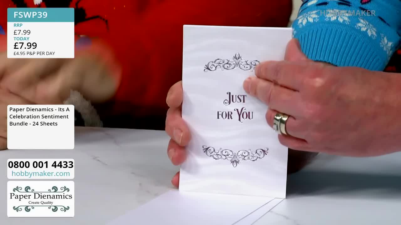 A hand smooths the front of a white card, printed with "Just For You" in elegant script. The Hobby Maker logo and price are visible in the corner.
