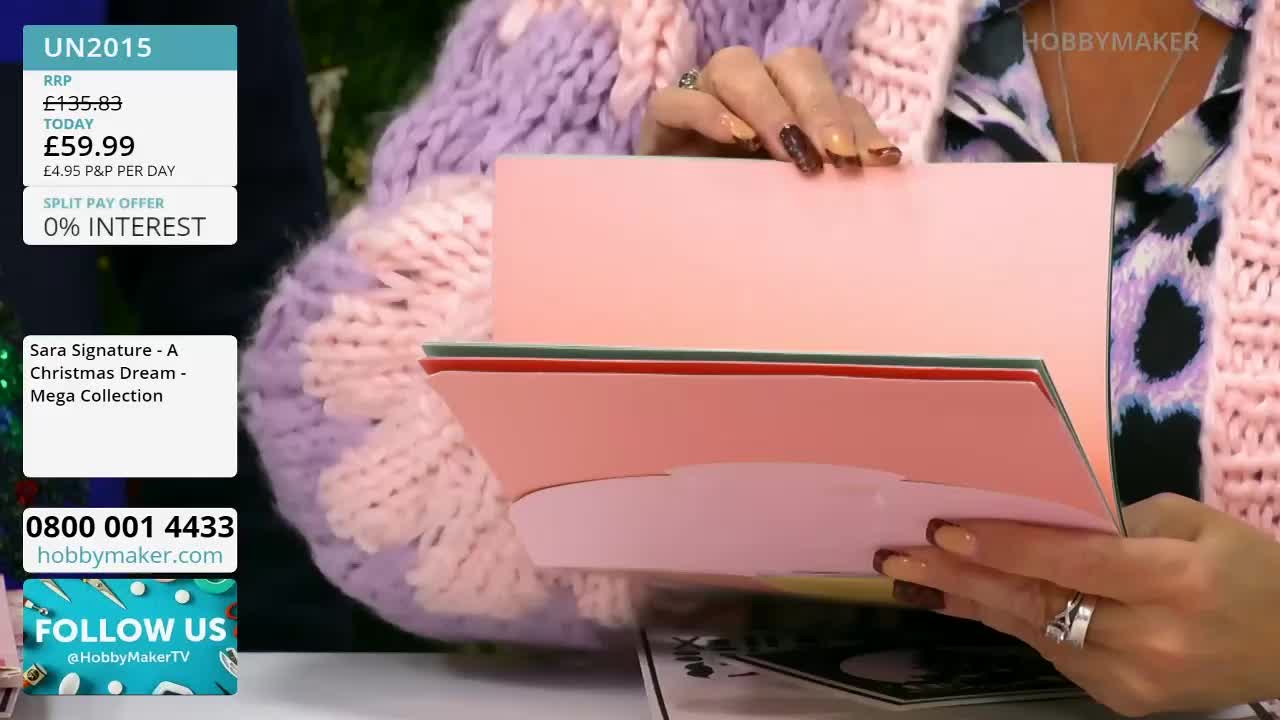 A person in a chunky, pastel-colored sweater opens a pink card, revealing layers of colored paper. The Hobby Maker logo is visible in the corner, and the on-screen text advertises a "Christmas Dream" collection.
