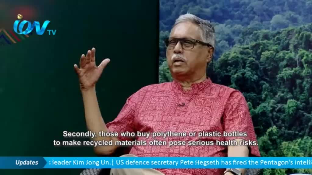 A man in a patterned pink shirt gestures with his right hand as he speaks, his face framed by glasses and a neatly trimmed mustache. The Ion TV logo is visible in the corner, and a green backdrop simulates a natural setting.
