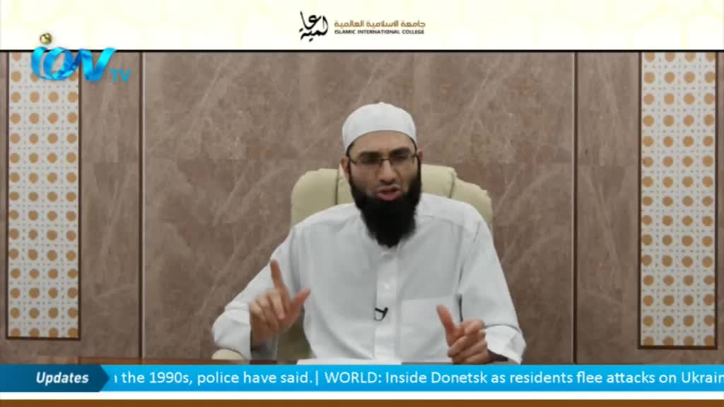 A man with a long black beard and glasses is speaking, gesturing with both hands. The ITV logo is visible in the corner, and a news ticker scrolls across the bottom of the screen.
