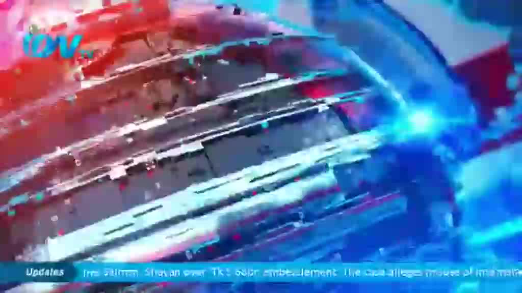 The ITV logo is visible in the upper left, as a swirling, digital graphic shifts across the screen. Jagged, metallic shapes, illuminated by red and blue light, rotate in the foreground.
