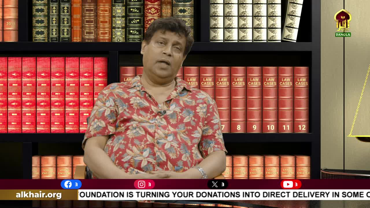 A man in a floral shirt sits in front of a bookshelf, speaking on what looks like an Iqra TV show from the United Kingdom. Behind him, the backdrop features rows of red-bound law books.
