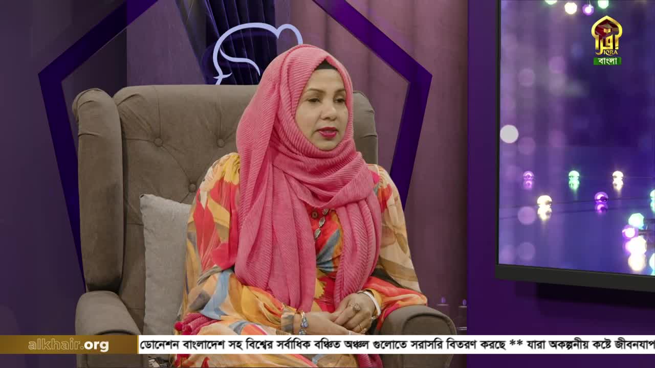 A woman in a pink hijab sits in a plush chair, speaking on a set for Iqra TV. The screen behind her displays a logo and what looks like a light show.
