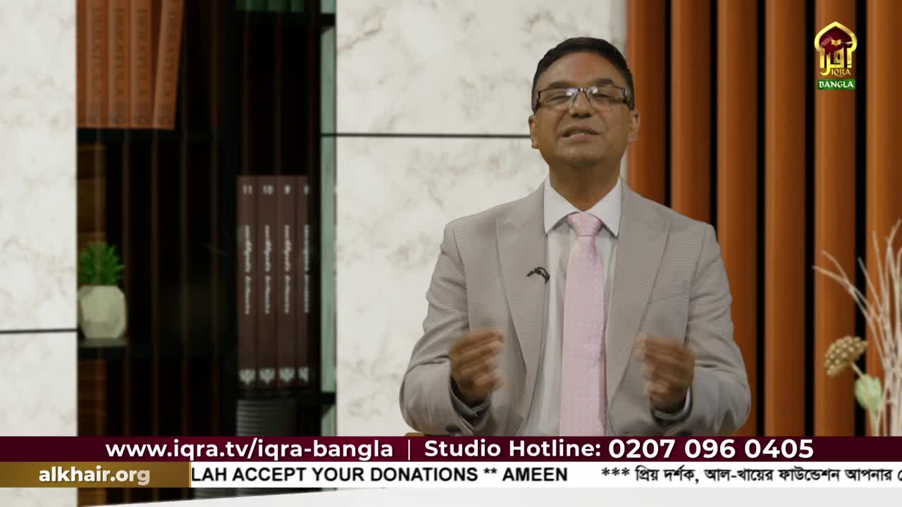 A man in a light gray suit and pink tie gestures with his hands, speaking directly to the camera. The Iqra TV logo is visible, and a phone number scrolls across the bottom of the screen.
