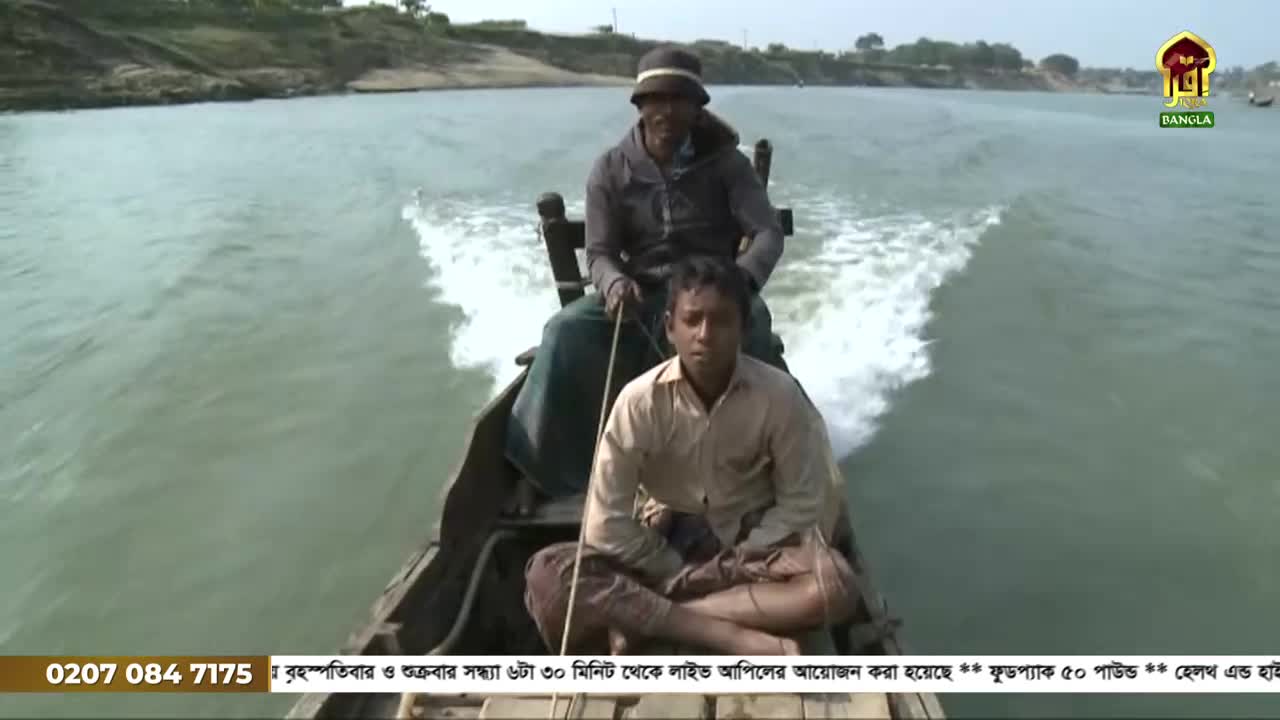 A small boat cuts through the water, leaving a white wake behind it. Two men are aboard, one steering and the other seated, their faces focused ahead.
