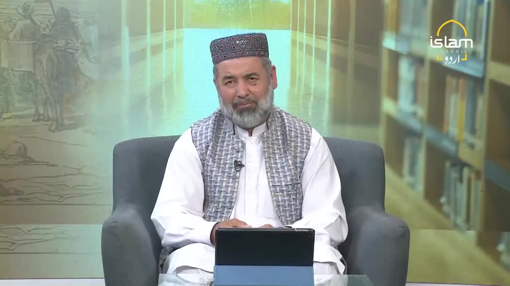 A man in a patterned cap and vest sits in a studio chair, looking directly at the camera. The logo for Islam Channel Urdu is visible in the background.
