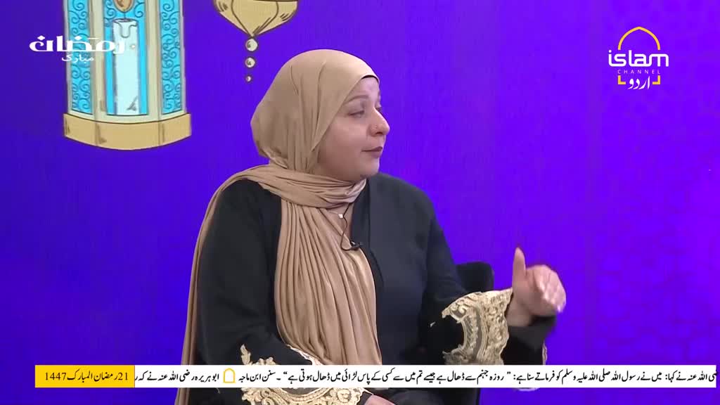 A woman in a beige hijab speaks animatedly on a television set, her hand gesturing as she talks. The Islam Channel Urdu logo is visible in the corner of the screen. A woman in a beige hijab speaks animatedly on a television set, her hand gesturing as she talks. The Islam Channel Urdu logo is visible in the corner of the screen.