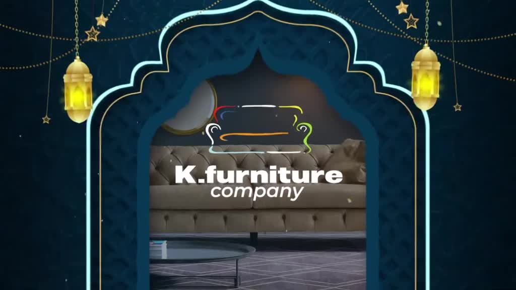 Golden lanterns hang from strings, illuminating a tufted sofa. The K. Furniture Company logo appears above the couch. Golden lanterns hang from strings, illuminating a tufted sofa. The K. Furniture Company logo appears above the couch.