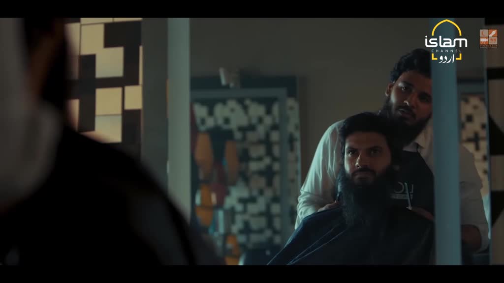 A barber in a white shirt leans over a man in a black cape, his hands resting on the man's shoulders. The Islam Channel Urdu logo is visible in the top right corner.