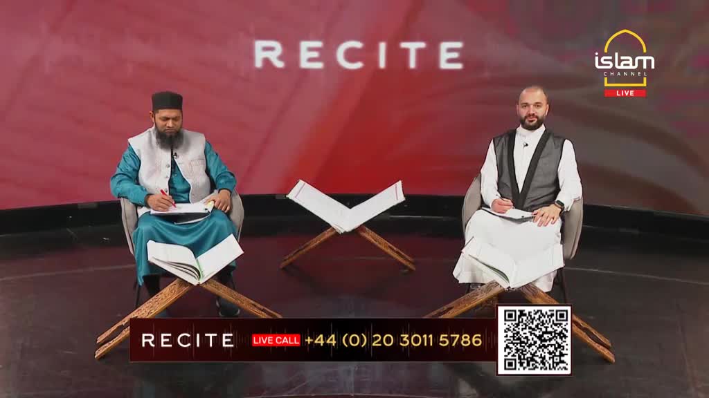 Two men sit facing each other on a stage, both with open books on wooden stands. The Islam Channel logo is visible, and the word "RECITE" is prominently displayed above them.

