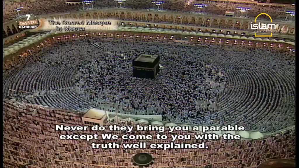 Thousands of people are gathered around the Kaaba in Mecca, a scene broadcast by Islam Channel. The crowd moves in concentric circles, a sea of white garments against the dark stone.