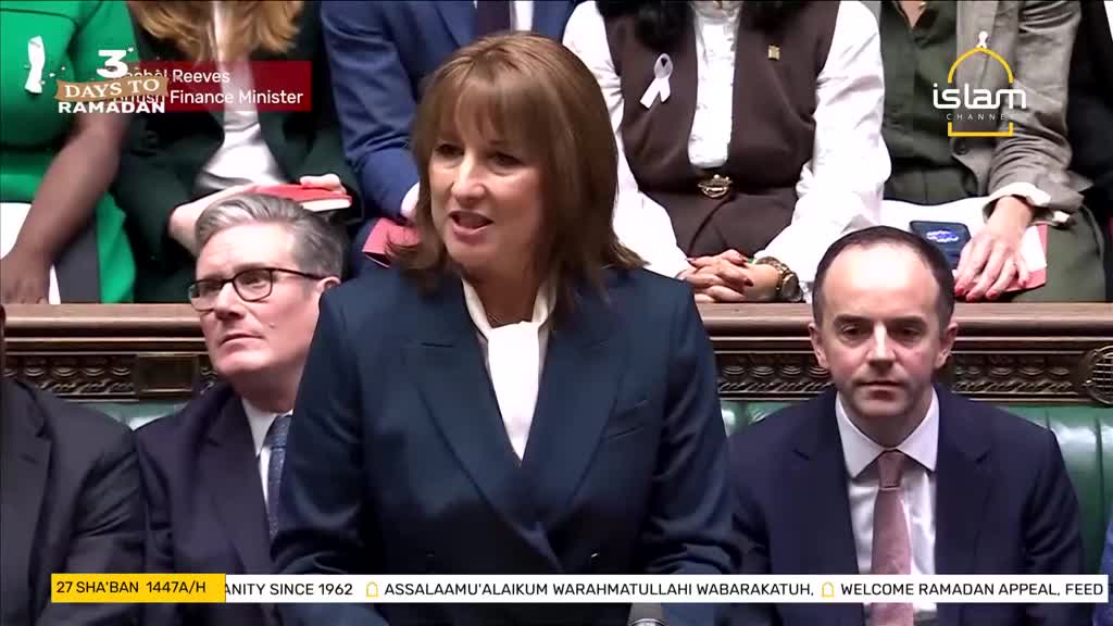 The Finance Minister speaks from the dispatch box, her voice clear and steady. Beside her, MPs listen intently, some with hands clasped, others looking towards the speaker.