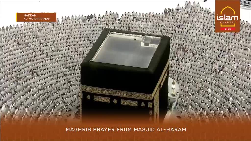Thousands of people in white clothing are gathered around the Kaaba for Maghrib prayer. The Islam Channel is broadcasting live from Makkah Al-Mukarramah.