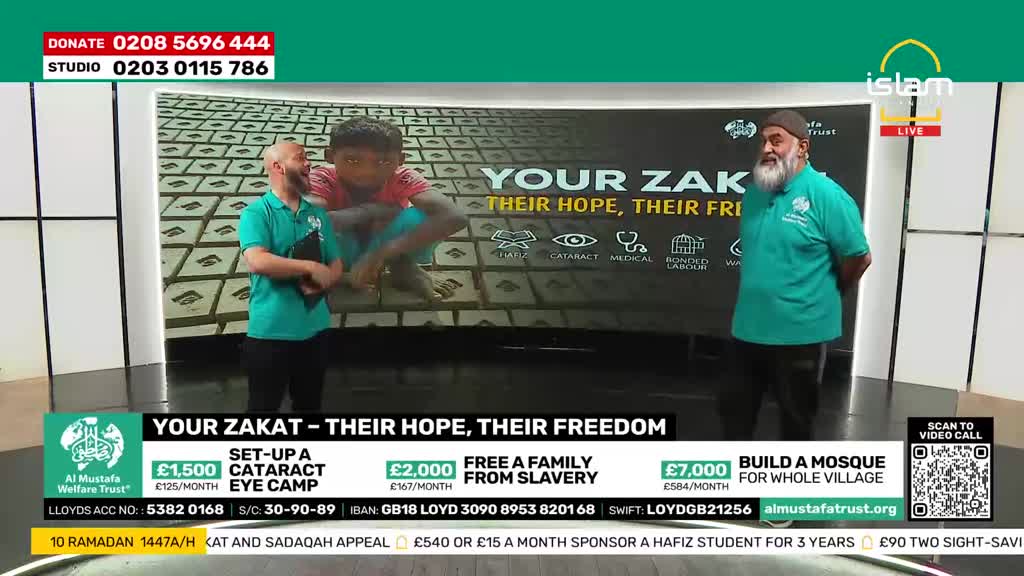 Two men stand on a stage, one with a shaved head and the other with a beard, both wearing green polo shirts. Behind them, a large screen displays the words "YOUR ZAKAT - THEIR HOPE, THEIR FREEDOM" next to an image of a young boy.