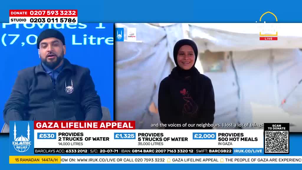 A man in a black beanie speaks from a studio with a blue background. To his right, a young woman in a hijab smiles, standing in front of white tents.