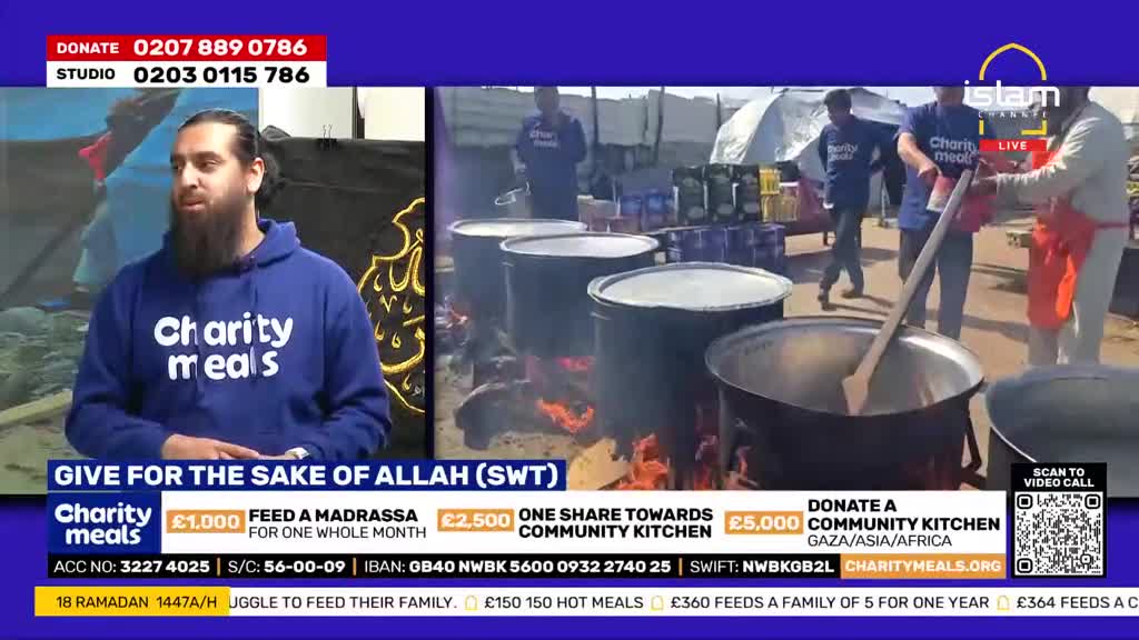Large pots bubble over open fires as people in blue shirts stir the contents. A man in an orange apron pours something into one of the steaming cauldrons.