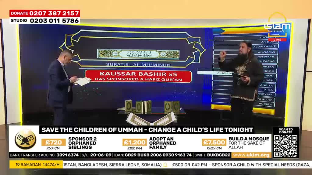 A man in a suit stands holding papers, while another man with a beard gestures with his hand. A screen behind them displays "SURATUL AL-MU'MINUN" and lists names.