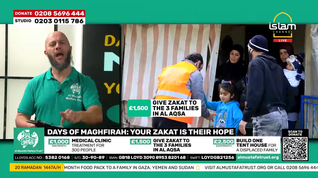 A man in an orange vest hands something to a young girl. A group of people stand behind them, some in winter clothing.