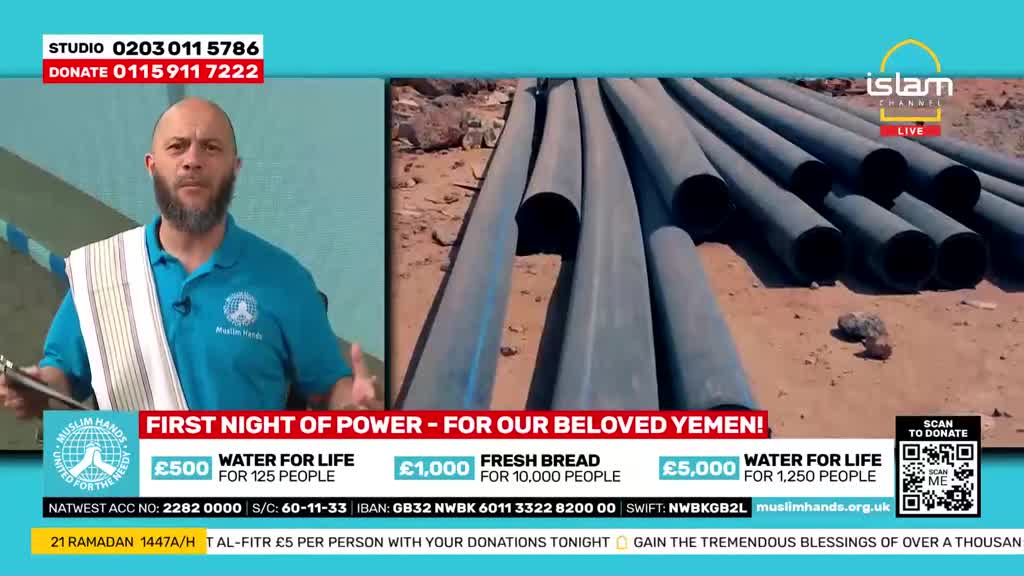 A man in a blue shirt gestures as he speaks, while a pile of large grey pipes lies on the ground beside him. The Islam Channel logo is visible in the corner.