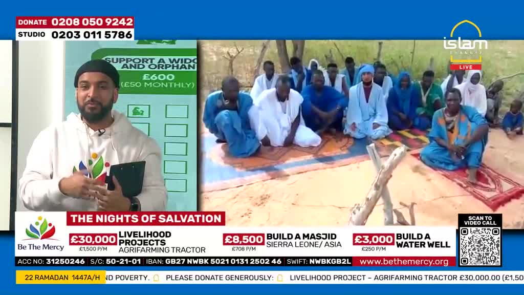 A group of men in blue and white robes are sitting on prayer mats outdoors, facing a man in a white hoodie on a television screen. The screen displays donation information for "The Nights of Salvation" from the UK-based Islam Channel.