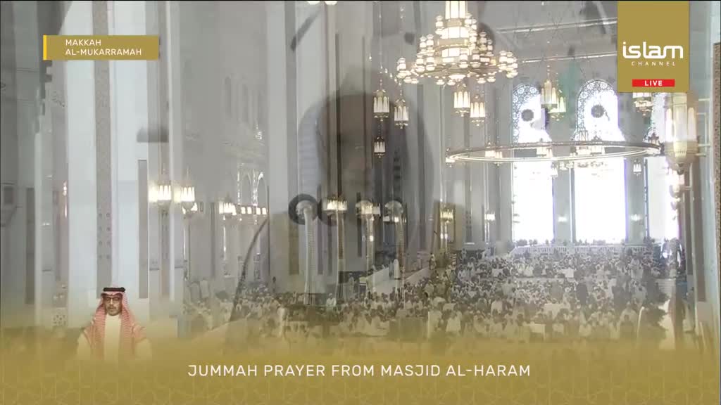 A large congregation gathers for Juma'ah prayer inside Masjid Al-Haram, with a man in traditional attire standing to the side. The Islam Channel broadcasts the event live from Makkah Al-Mukarramah.