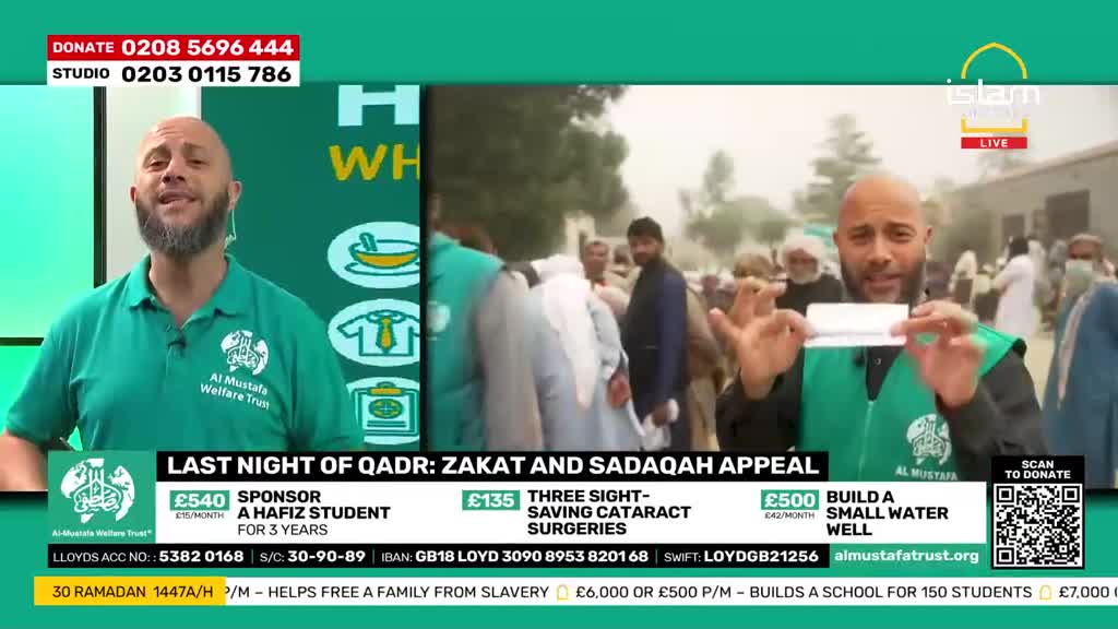 A man in a green vest holds up a white card, gesturing to a crowd of people behind him. The Islam Channel logo is visible in the corner of the screen. A man in a green vest holds up a white card, gesturing to a crowd of people behind him. The Islam Channel logo is visible in the corner of the screen.