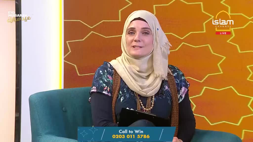 A woman in a beige hijab sits on a teal chair, speaking to the camera. The Islam Channel logo appears on the right side of the screen, with "Eid Mubarak" text visible on the left. A woman in a beige hijab sits on a teal chair, speaking to the camera. The Islam Channel logo appears on the right side of the screen, with "Eid Mubarak" text visible on the left.