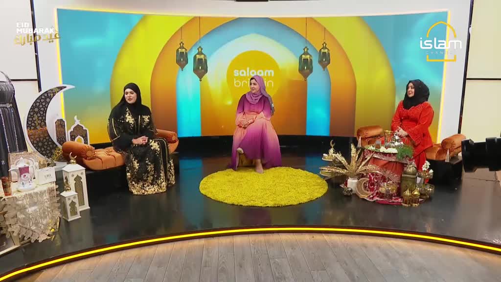 Three women are seated on a studio set, dressed in elegant Islamic attire. The background features a vibrant, arched design with lanterns, and the "Islam Channel" logo is visible. Three women are seated on a studio set, dressed in elegant Islamic attire. The background features a vibrant, arched design with lanterns, and the "Islam Channel" logo is visible.