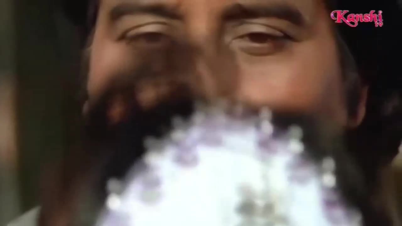 A man's face is in focus, his eyes fixed on something just out of view. Below him, a blurry, light-colored object obscures the bottom of the frame, possibly from Kanshi TV.
A man's face is in focus, his eyes fixed on something just out of view. Below him, a blurry, light-colored object obscures the bottom of the frame, possibly from Kanshi TV.