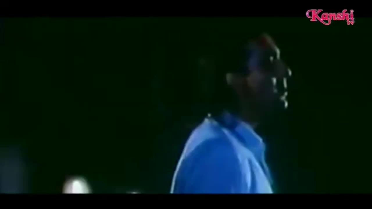 A man in a blue shirt stands in the dark, his face turned to the side. The Kanshi TV logo is in the corner, and it looks like a scene from a film.
A man in a blue shirt stands in the dark, his face turned to the side. The Kanshi TV logo is in the corner, and it looks like a scene from a film.