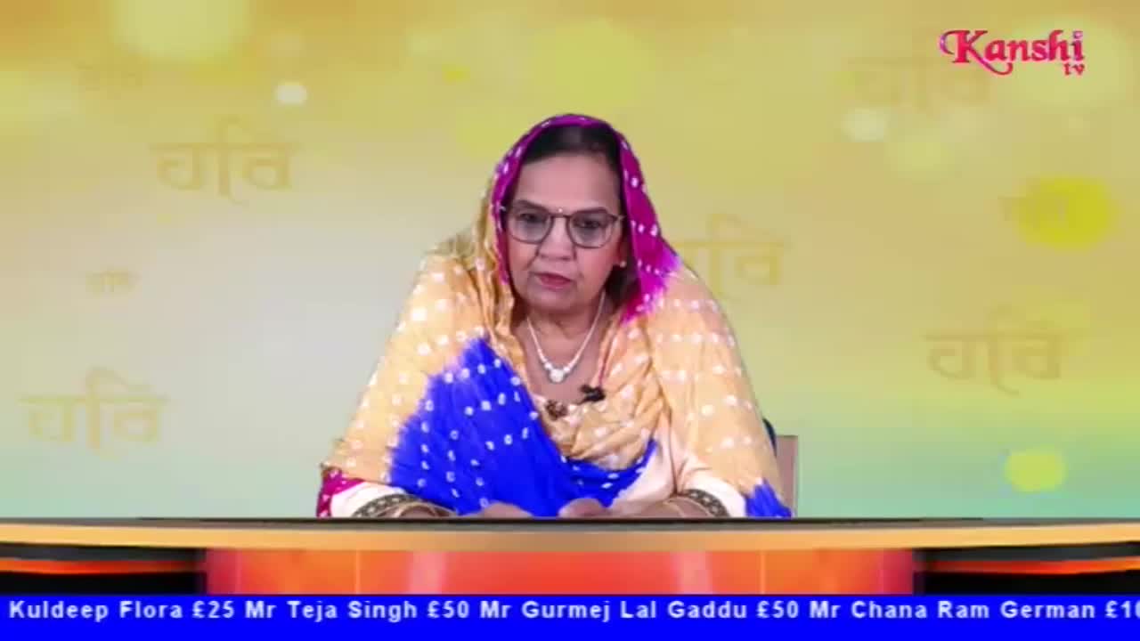 A woman in glasses and a patterned headscarf sits at a desk, speaking on Kanshi TV. Below, a blue banner displays names and monetary amounts.
A woman in glasses and a patterned headscarf sits at a desk, speaking on Kanshi TV. Below, a blue banner displays names and monetary amounts.