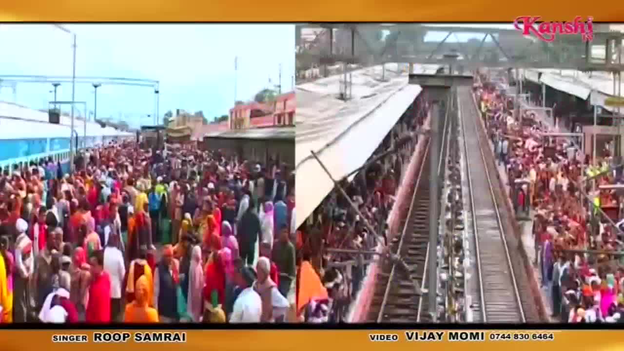 A long, light blue train sits at the platform, surrounded by a dense crowd of people in colourful clothing. On the right, a view from above shows a railway track packed with people on either side, stretching into the distance.