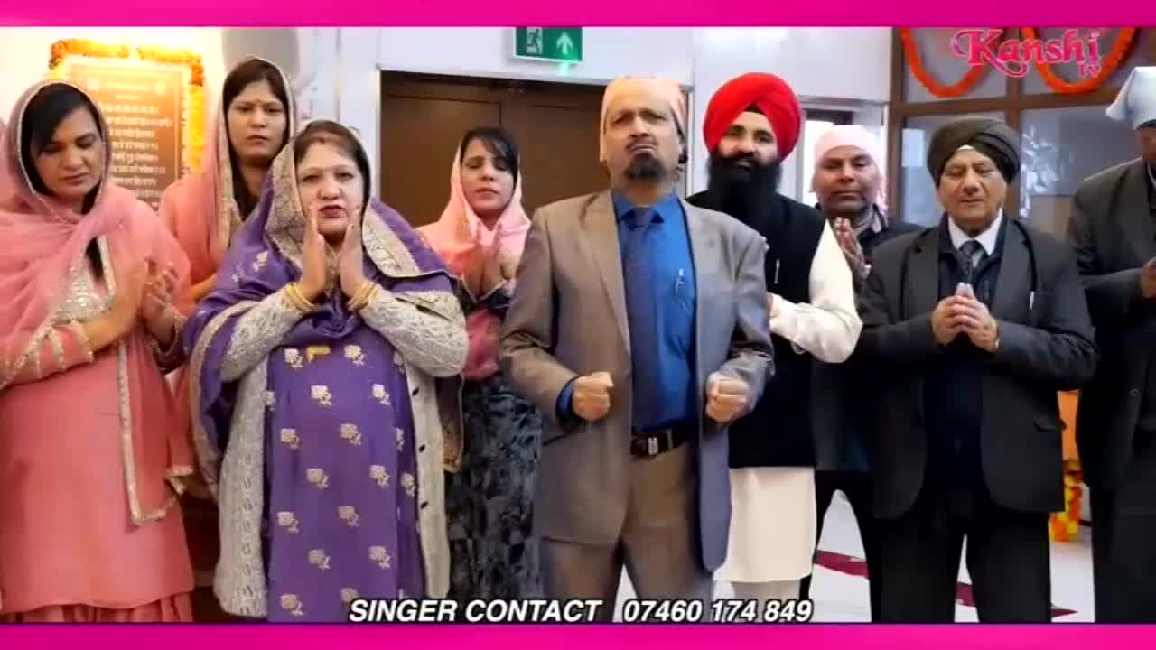 A group of people stand with their hands pressed together in prayer. The Kanshi TV logo is visible in the upper right corner.